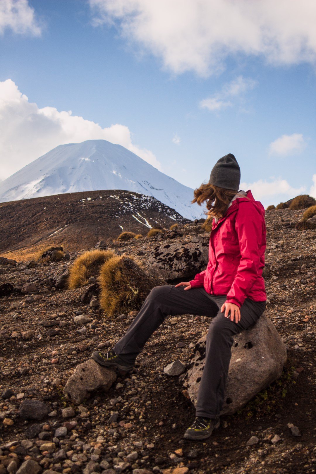 girl-sitting-looking-at-mt-ngaruahoe-in-winter