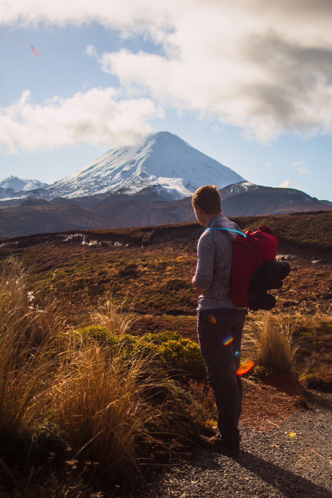 man-looking-at-mt-ngaruahoe-in-winter
