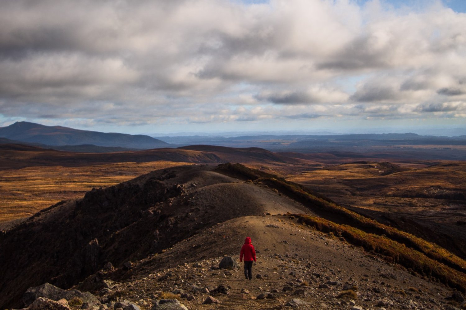 woman-walking-along-ridge-near-tama-lakes